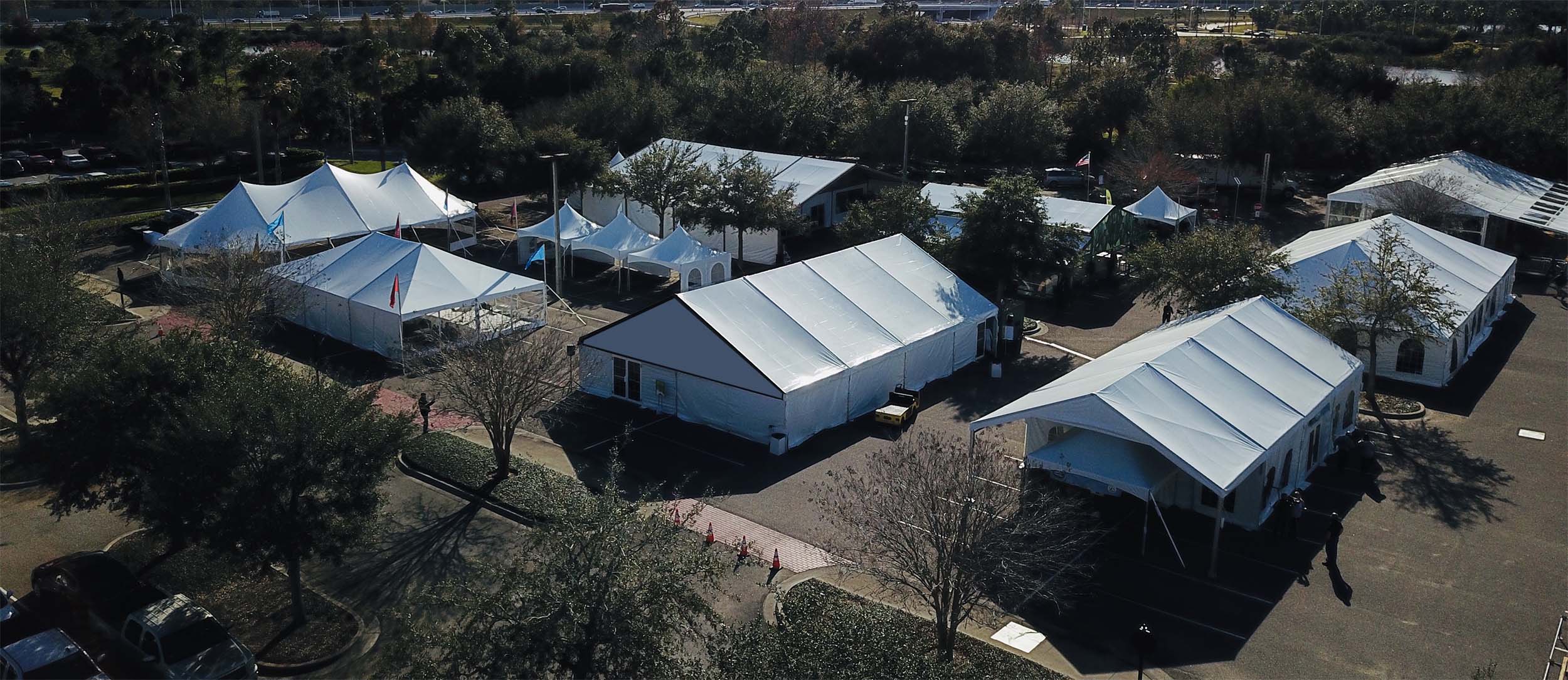 Aerial view of base camp tent structures deployed for disaster relief with multiple connected units