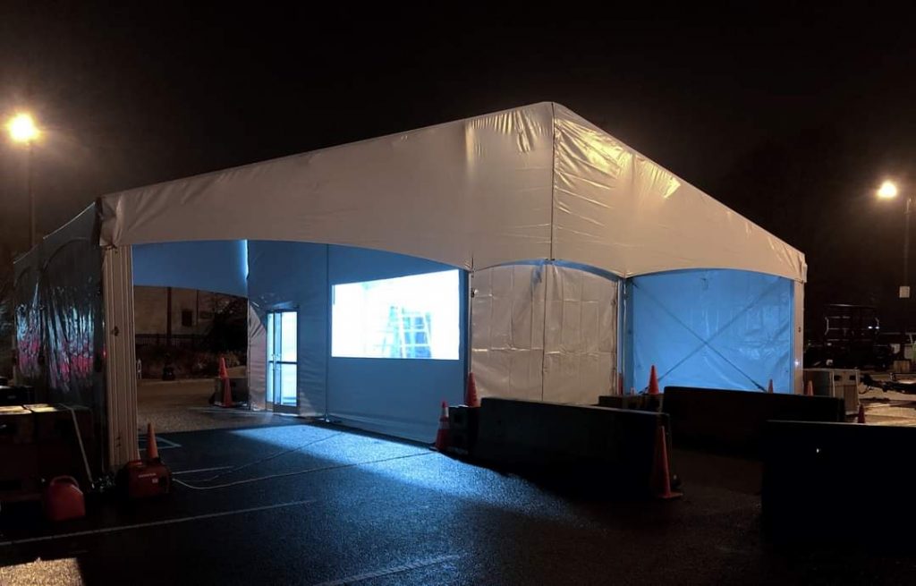 Disaster relief tent structures used for emergency supply storage and equipment staging