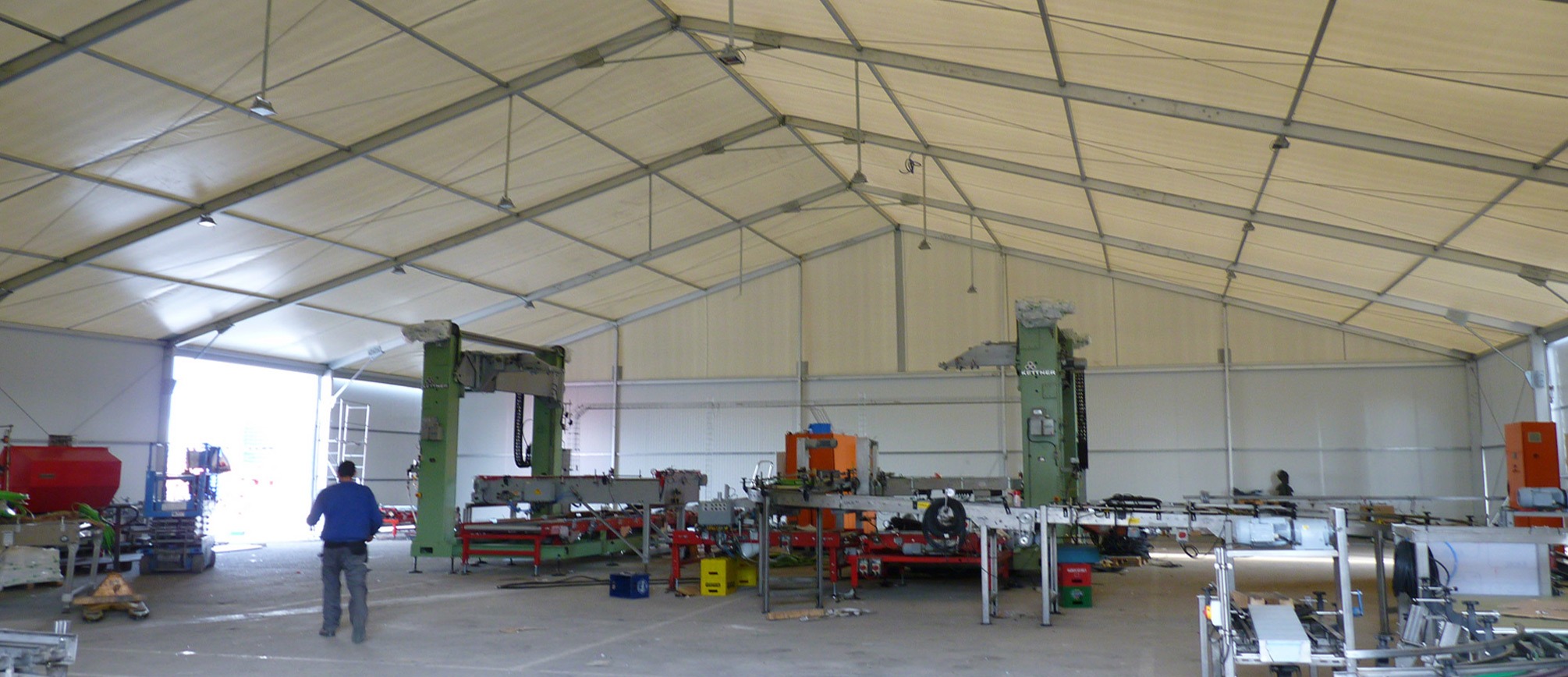 Temporary warehouse tent used for construction material storage and job site operations