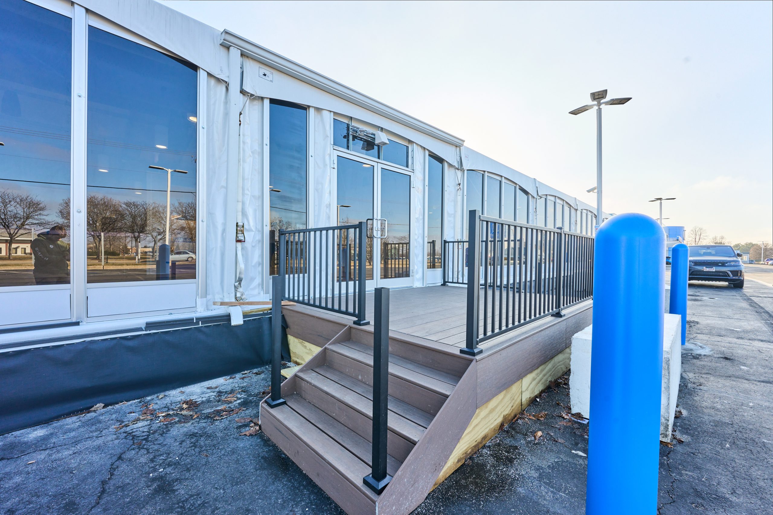 Temporary office building with glass walls and professional entry deck